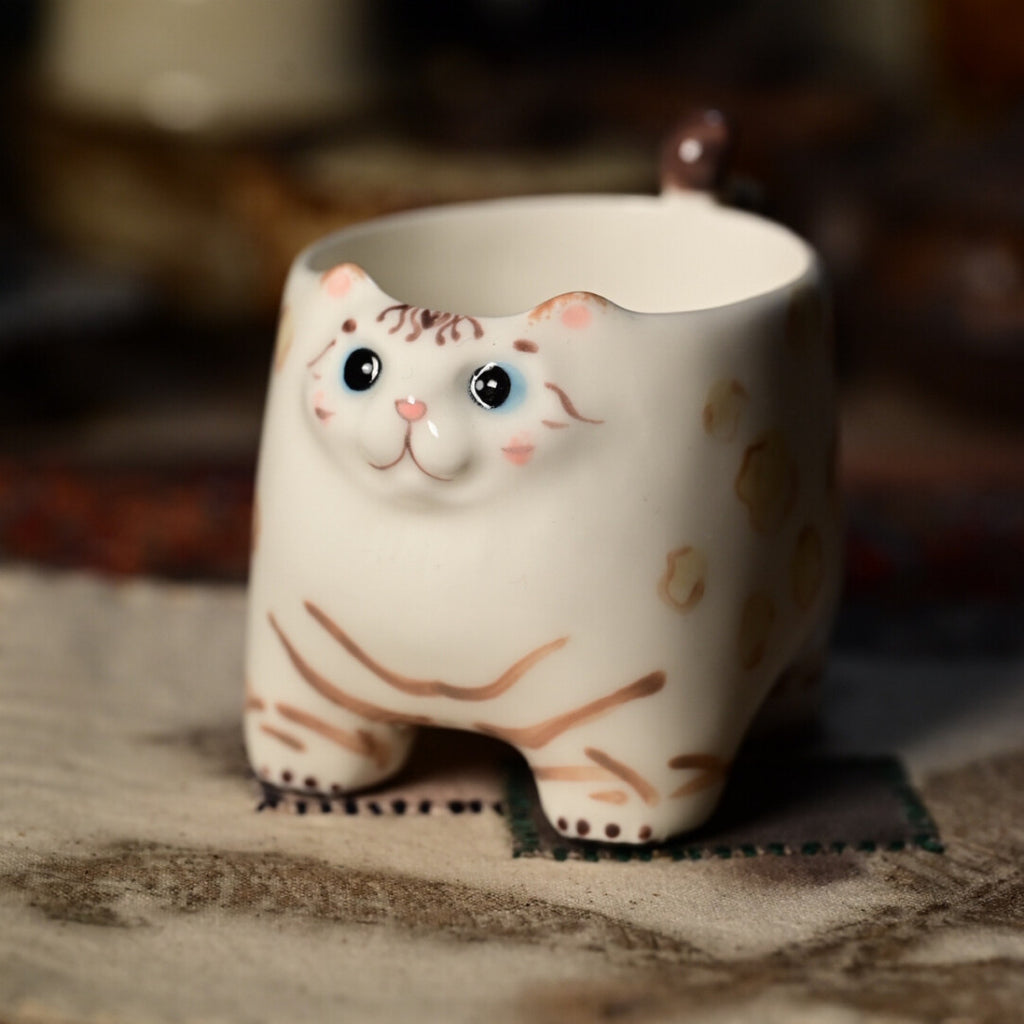 Tazza a forma di coda di gatto